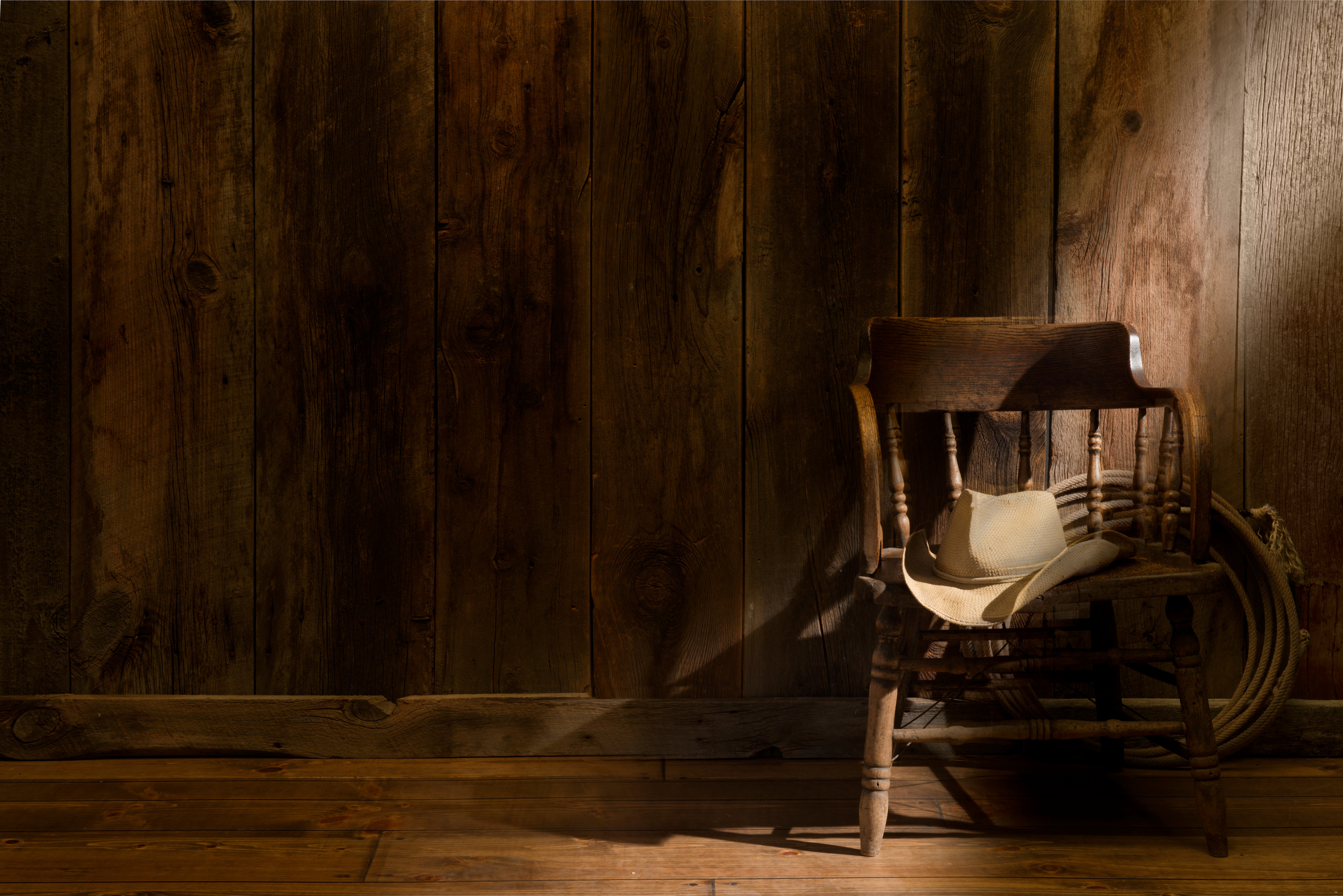 Western theme with rustic barnwood and saloon chair